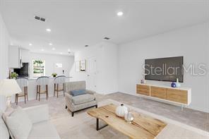 2995 Skyline Loop Kissimmee, FL 34758 - Photo 14 of 46 a living room with furniture and a table