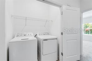 2995 Skyline Loop Kissimmee, FL 34758 - Photo 16 of 46 a utility room with dryer and washer