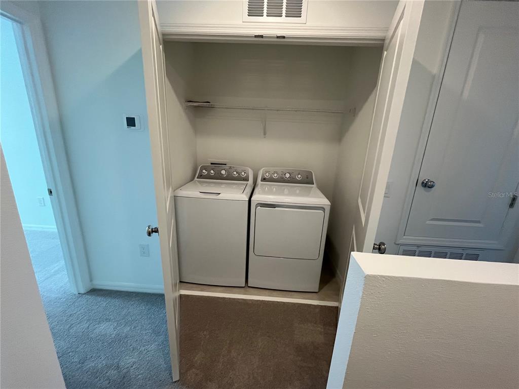 2995 Skyline Loop Kissimmee, FL 34758 - Photo 17 of 46 a utility room with dryer and washer