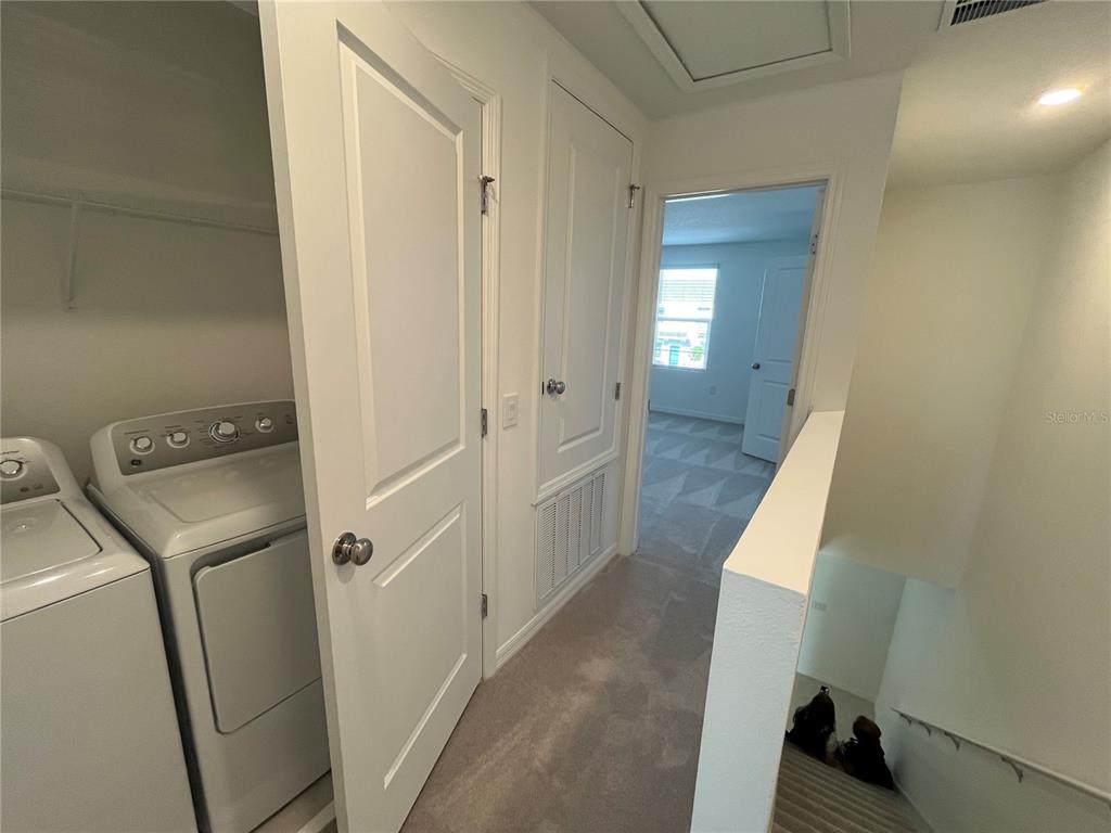 2995 Skyline Loop Kissimmee, FL 34758 - Photo 18 of 46 a view of a hallway with wooden floor and closet