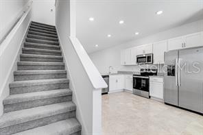 2995 Skyline Loop Kissimmee, FL 34758 - Photo 2 of 46 a view of kitchen with sink microwave and refrigerator