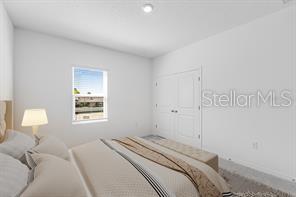 2995 Skyline Loop Kissimmee, FL 34758 - Photo 22 of 46 a bedroom with a bed and a window