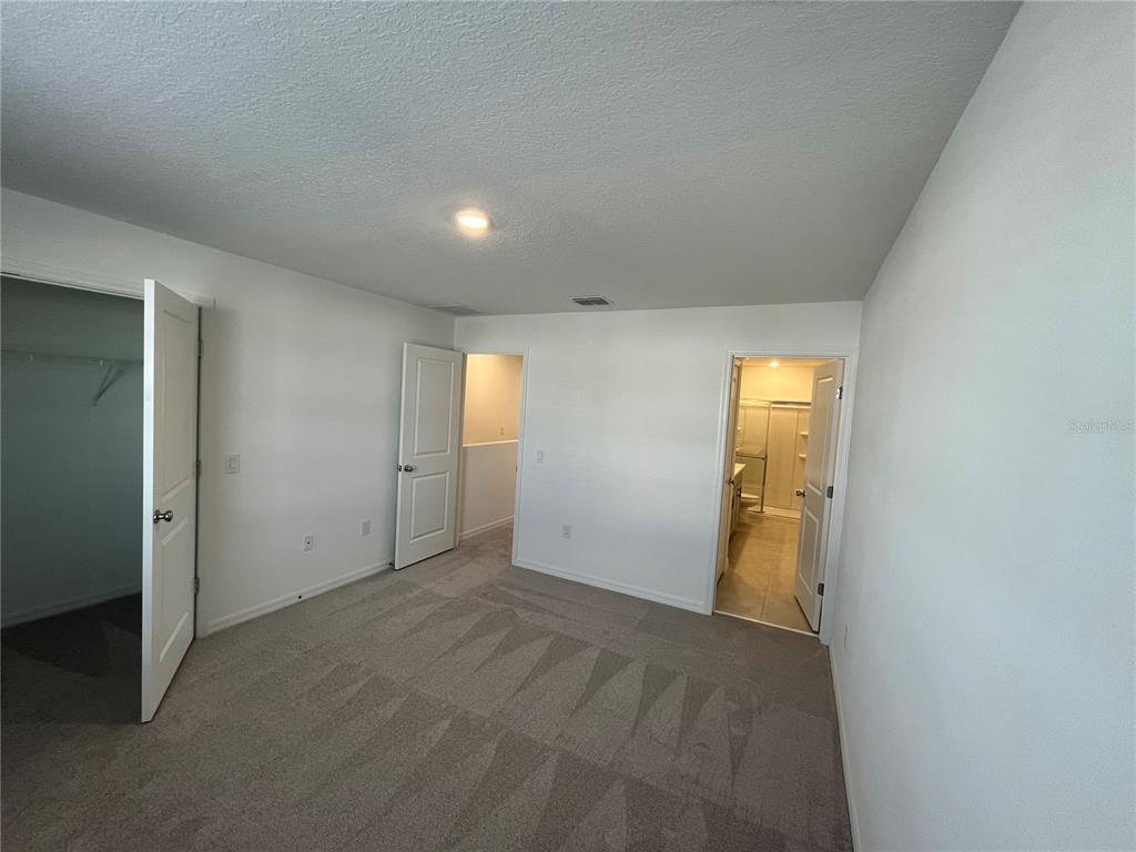2995 Skyline Loop Kissimmee, FL 34758 - Photo 23 of 46 an empty room with windows