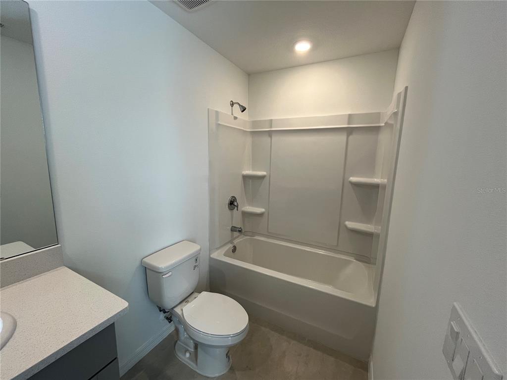 2995 Skyline Loop Kissimmee, FL 34758 - Photo 34 of 46 a bathroom with a sink a toilet and a bathtub