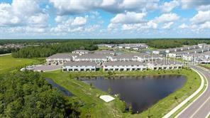 2995 Skyline Loop Kissimmee, FL 34758 - Photo 40 of 46 a view of a lake with a city