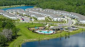 2995 Skyline Loop Kissimmee, FL 34758 - Photo 41 of 46 a view of a swimming pool with a yard