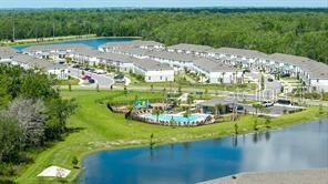 2995 Skyline Loop Kissimmee, FL 34758 - Photo 42 of 46 a view of a swimming pool with a yard