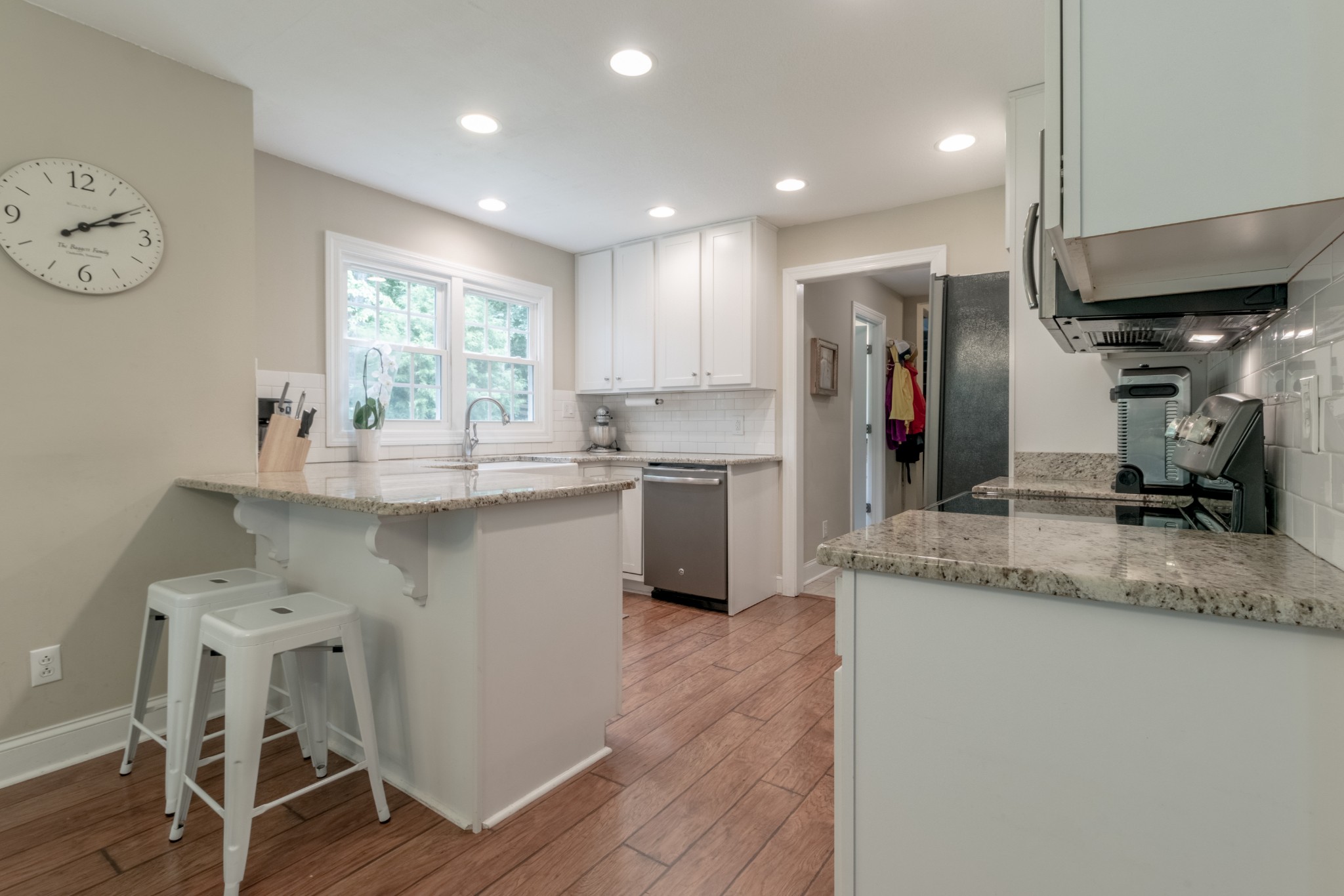 491 Harper Road Clarksville, TN 37043 - Photo 13 of 33 a kitchen with stainless steel appliances granite countertop a sink cabinets and wooden floor