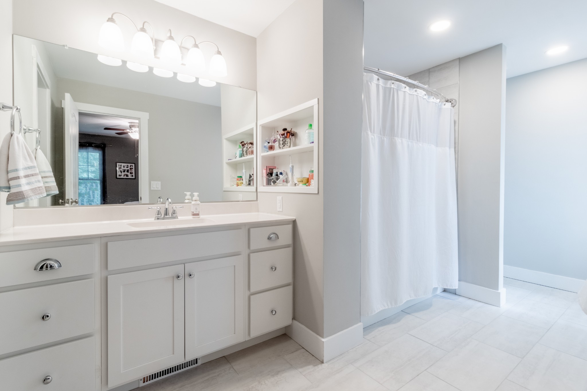 491 Harper Road Clarksville, TN 37043 - Photo 18 of 33 a bathroom with a double vanity sink mirror and