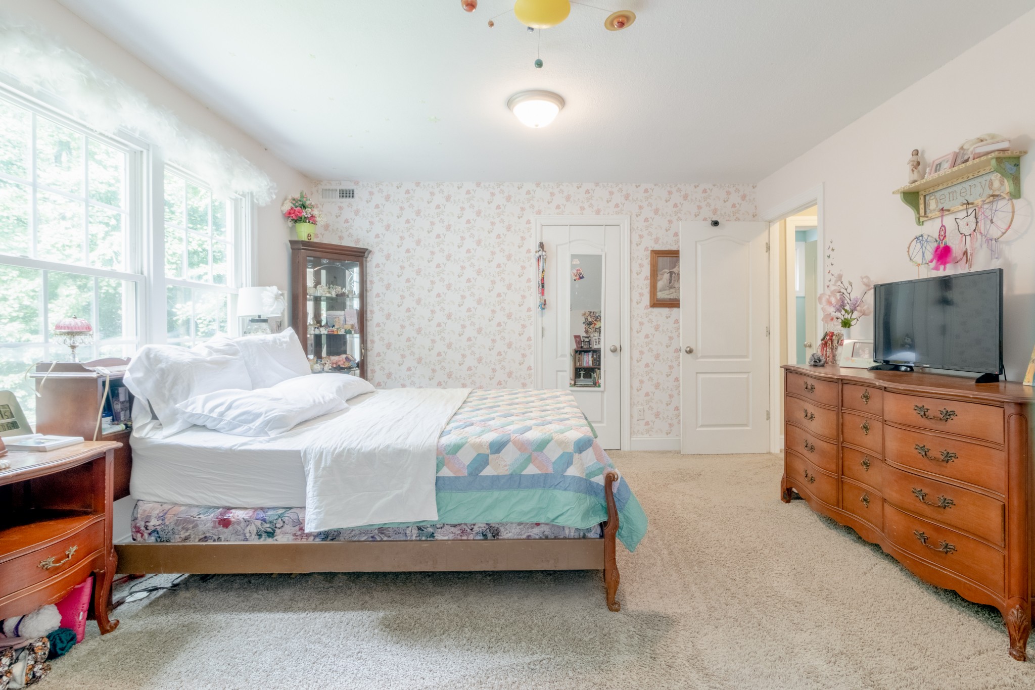 491 Harper Road Clarksville, TN 37043 - Photo 21 of 33 a bedroom with a bed a flat screen tv and a window
