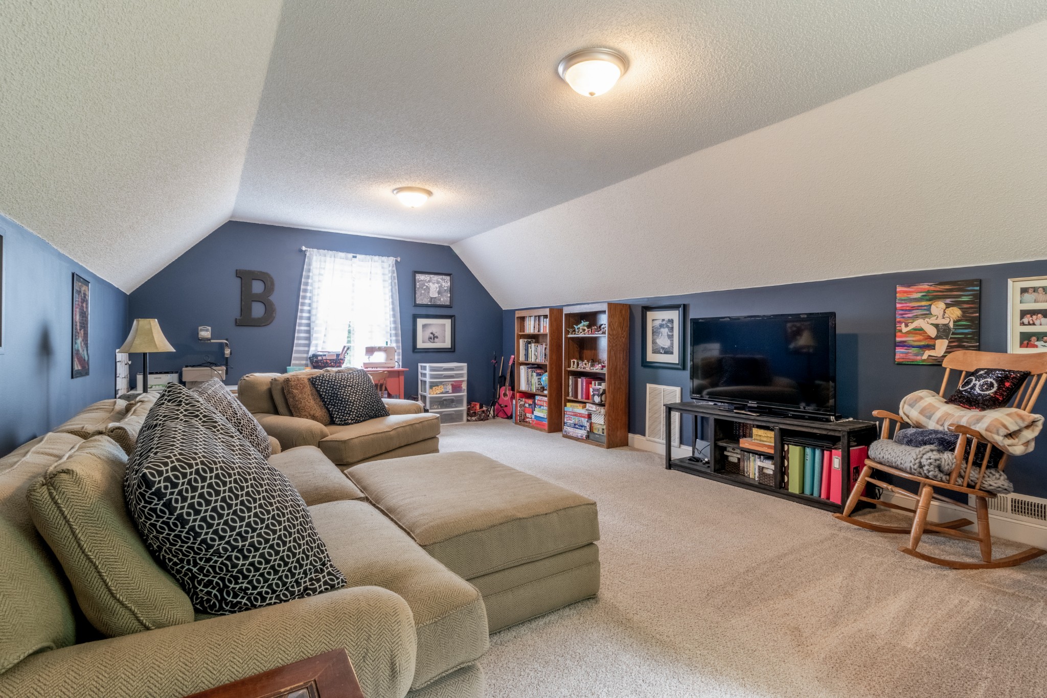 491 Harper Road Clarksville, TN 37043 - Photo 24 of 33 a living room with furniture and a flat screen tv