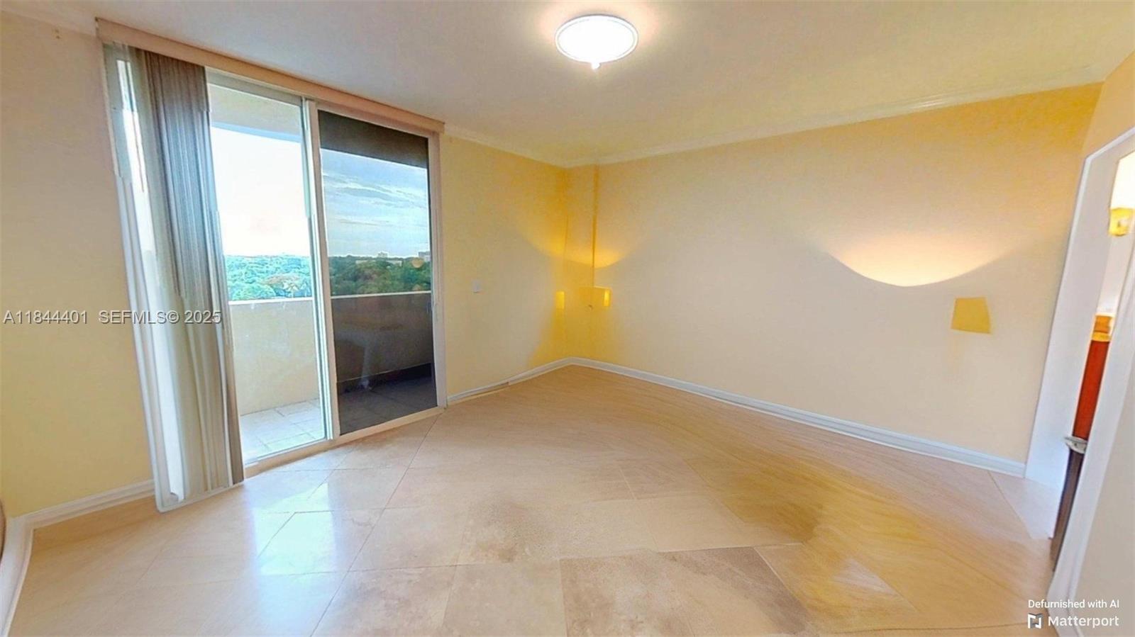 2425 Southwest 27th Avenue, Unit 701 Miami, FL 33145 - Photo 22 of 57 a view of an empty room with a window