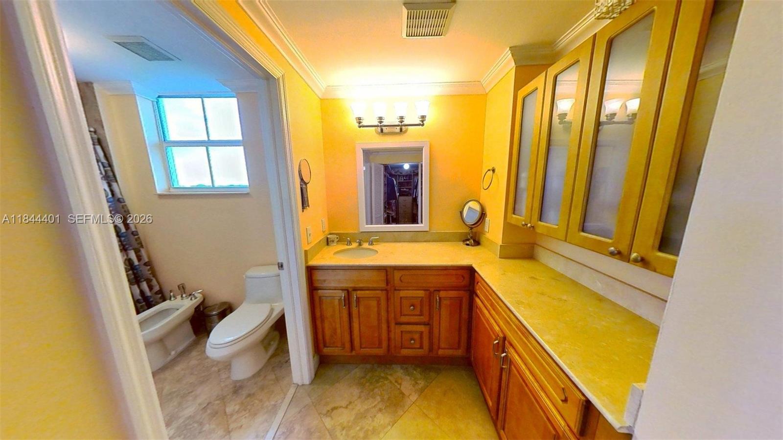 2425 Southwest 27th Avenue, Unit 701 Miami, FL 33145 - Photo 22 of 49 Primary Bathroom and Vanity