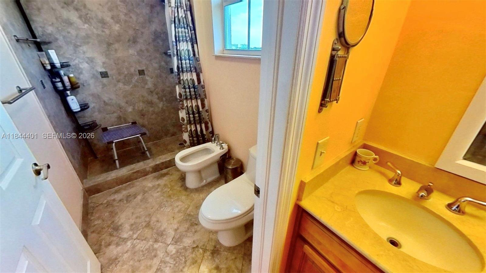 2425 Southwest 27th Avenue, Unit 701 Miami, FL 33145 - Photo 23 of 49 Primary Bathroom and Vanity