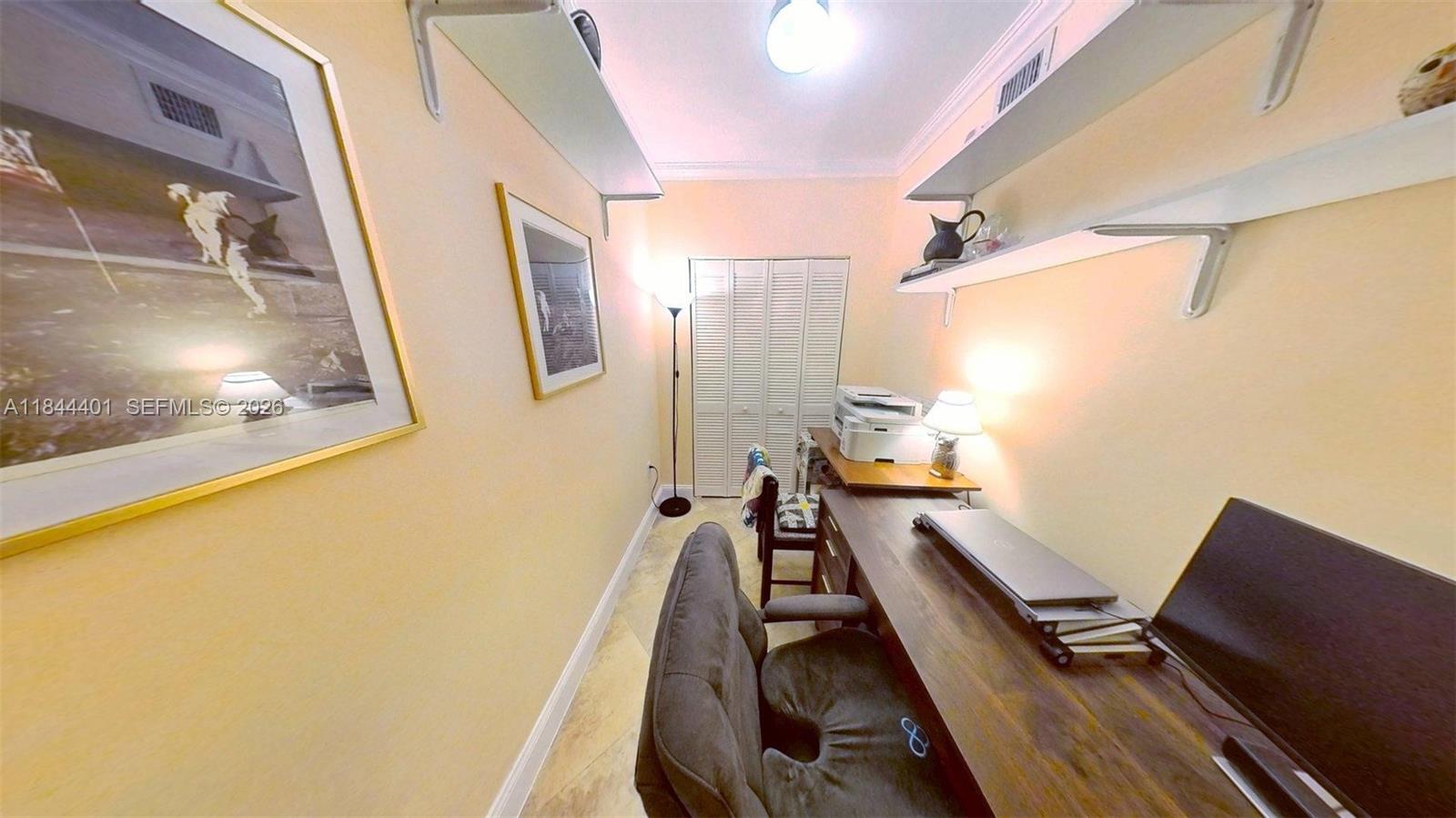 2425 Southwest 27th Avenue, Unit 701 Miami, FL 33145 - Photo 27 of 49 Den/Office With Closet Storage
