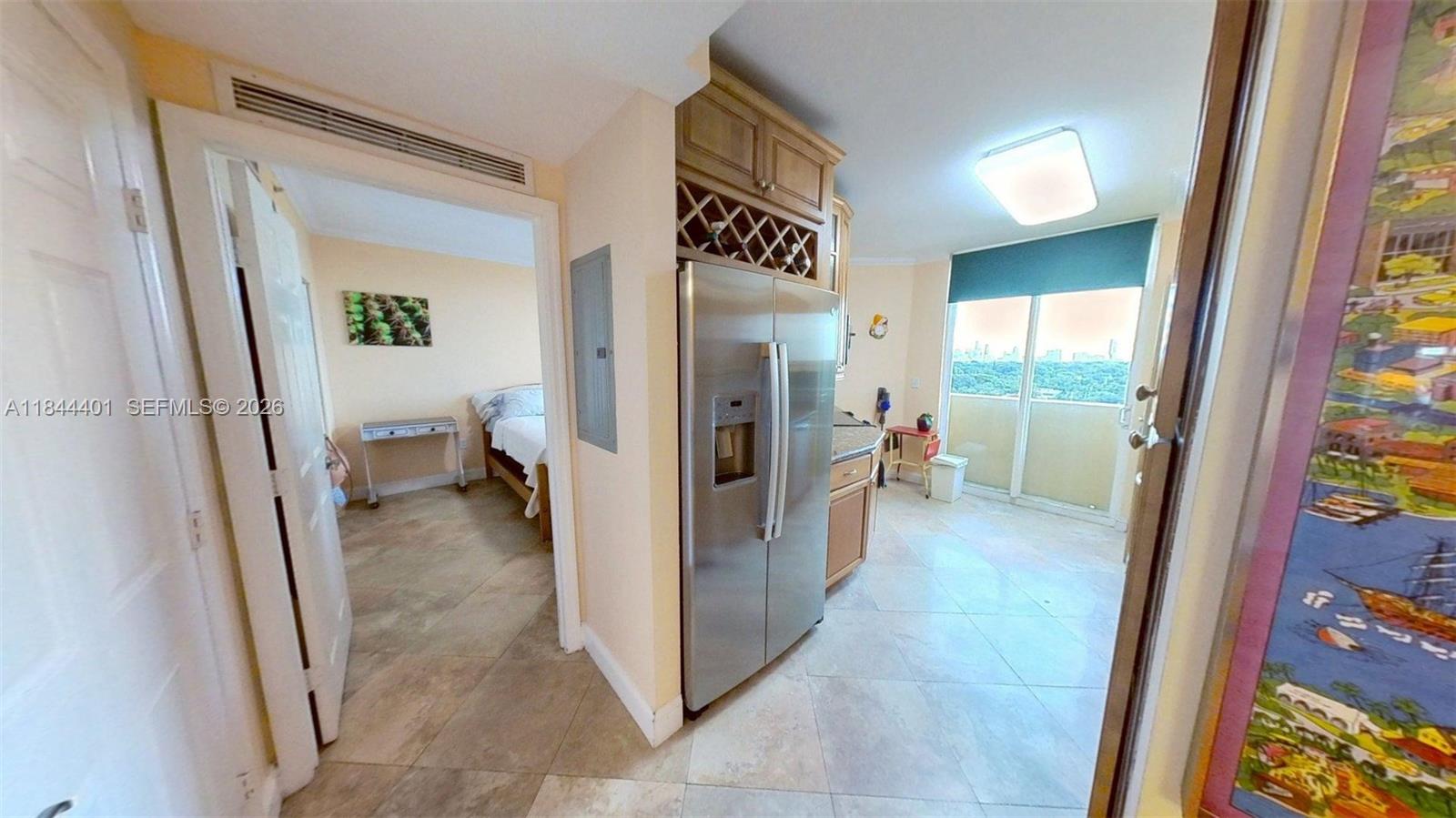 2425 Southwest 27th Avenue, Unit 701 Miami, FL 33145 - Photo 28 of 49 a view of a hallway to a livingroom and a hallway