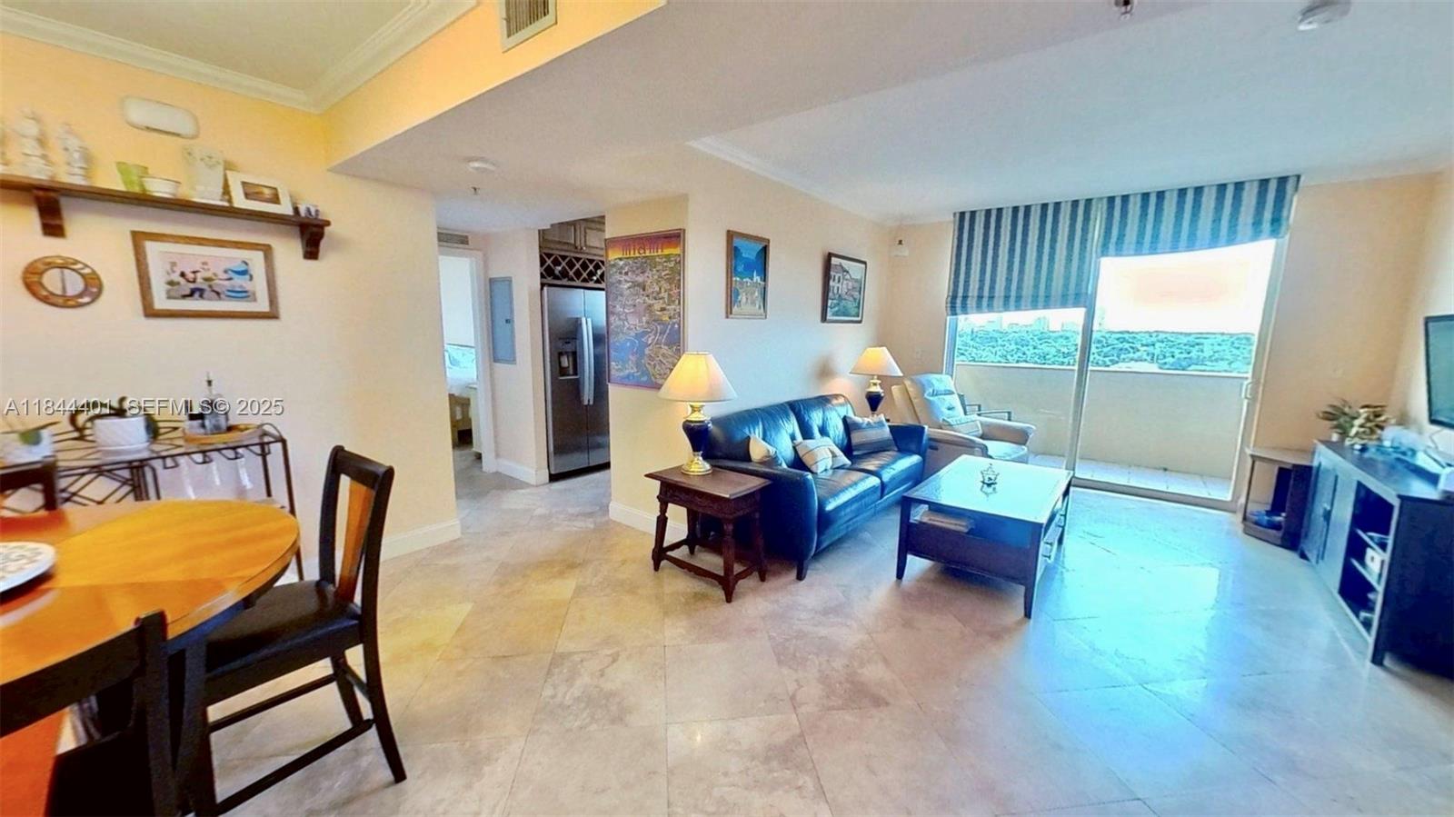 2425 Southwest 27th Avenue, Unit 701 Miami, FL 33145 - Photo 3 of 57 a living room with furniture and a large window