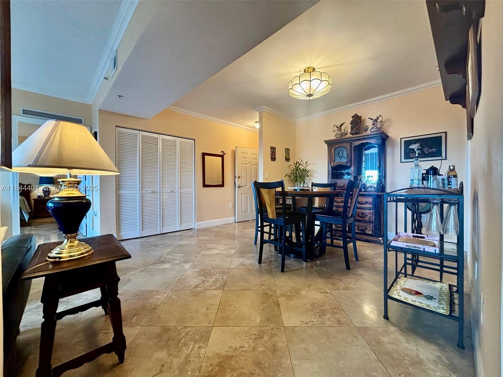 2425 Southwest 27th Avenue, Unit 701 Miami, FL 33145 - Photo 35 of 57 a dining room with furniture and window