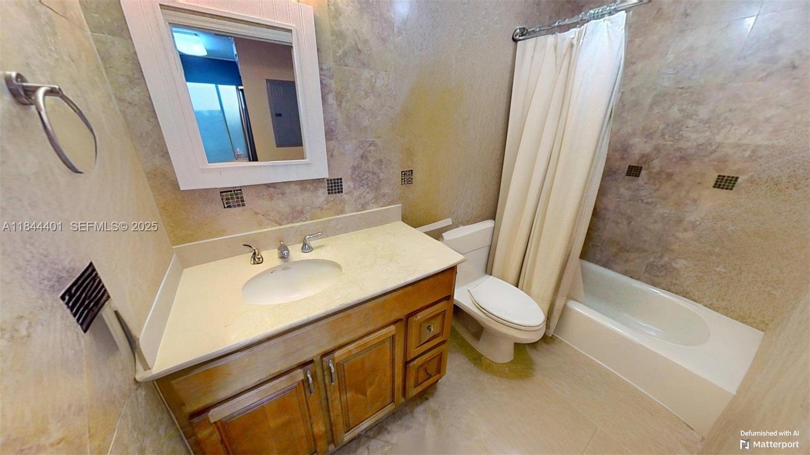 2425 Southwest 27th Avenue, Unit 701 Miami, FL 33145 - Photo 43 of 57 a bathroom with a sink toilet and shower