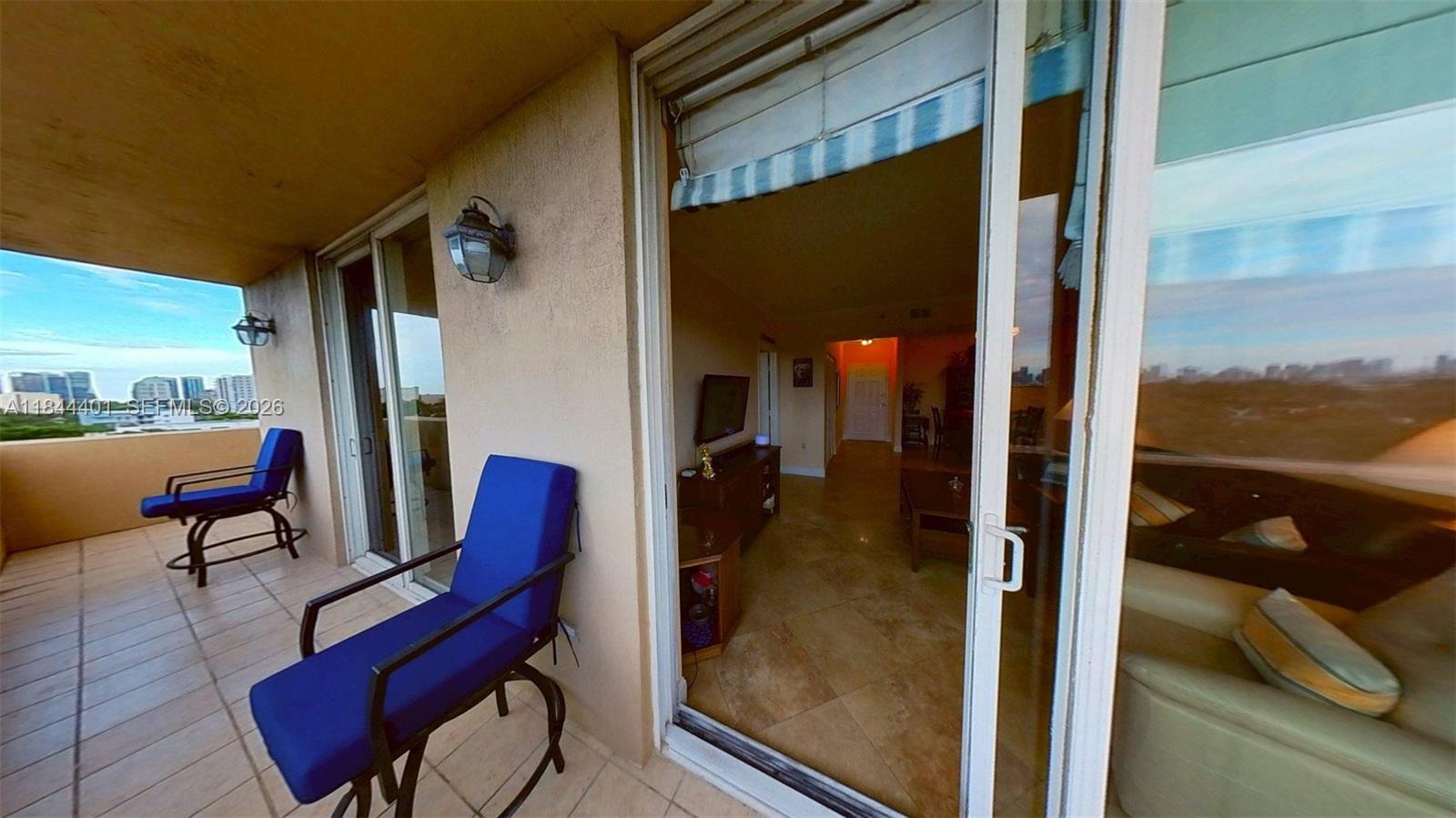 2425 Southwest 27th Avenue, Unit 701 Miami, FL 33145 - Photo 6 of 49 a view of balcony with furniture