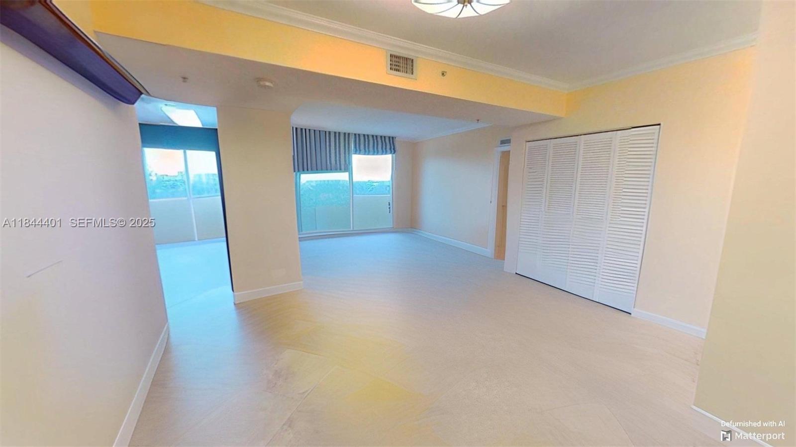 2425 Southwest 27th Avenue, Unit 701 Miami, FL 33145 - Photo 9 of 57 De-Furnished View of Living/Dining Areas