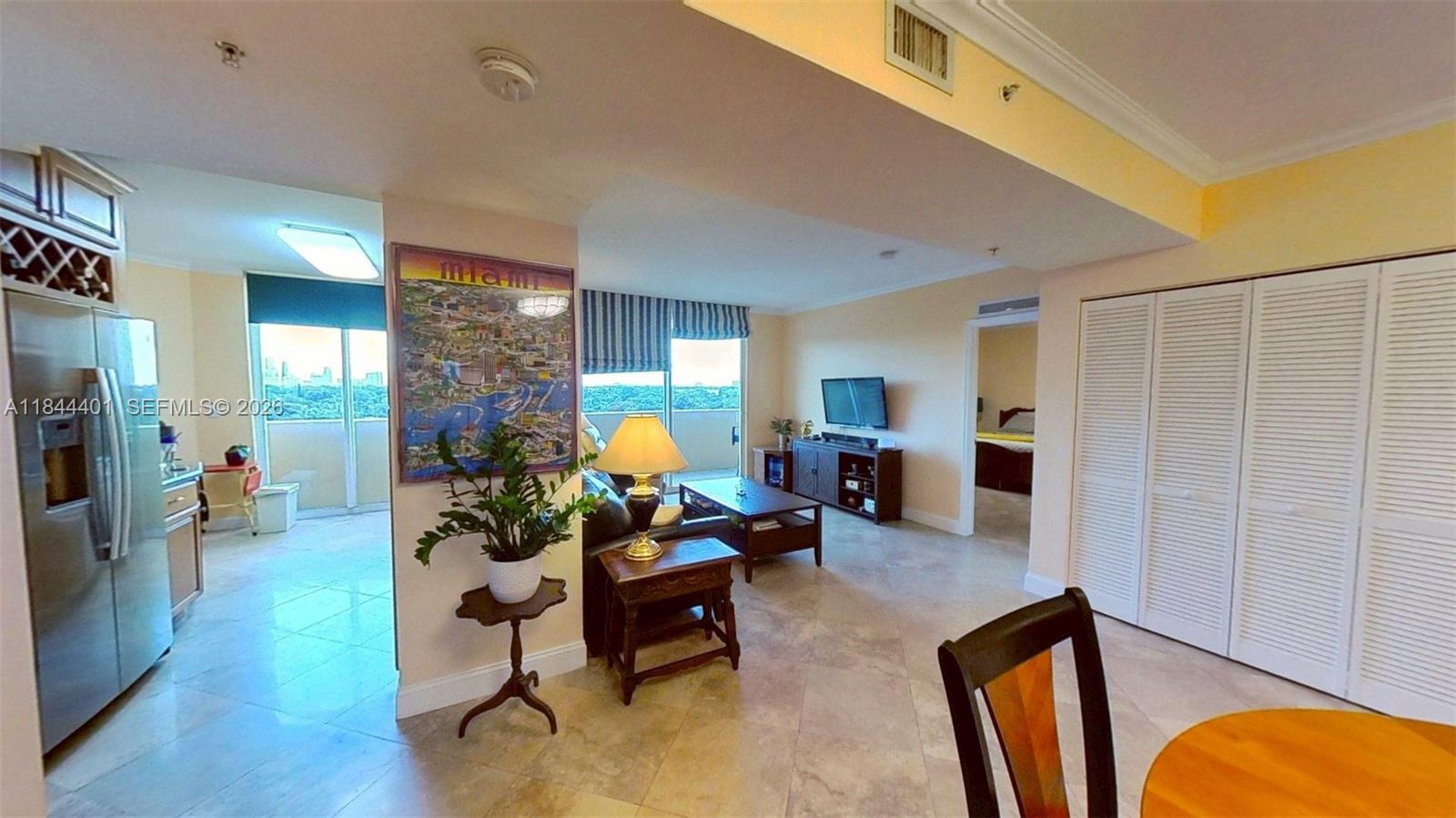 2425 Southwest 27th Avenue, Unit 701 Miami, FL 33145 - Photo 9 of 49 a living room with furniture rug and wooden floor