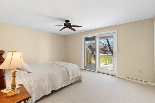 a bed room with a bed and a window