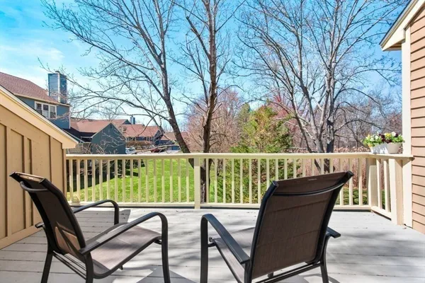 a view of a chair and table on the deck