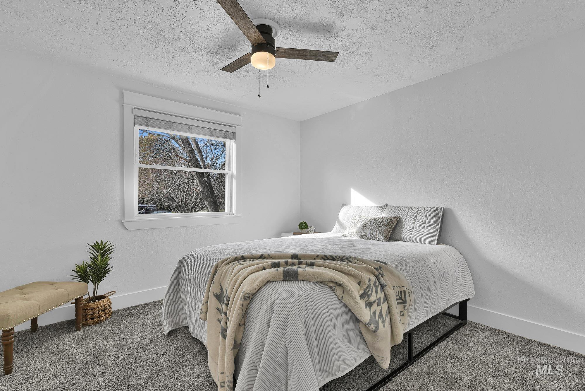 3630 Beverly Street Boise, ID 83709 - Photo 20 of 50 Carpeted bedroom with a textured ceiling and ceiling fan