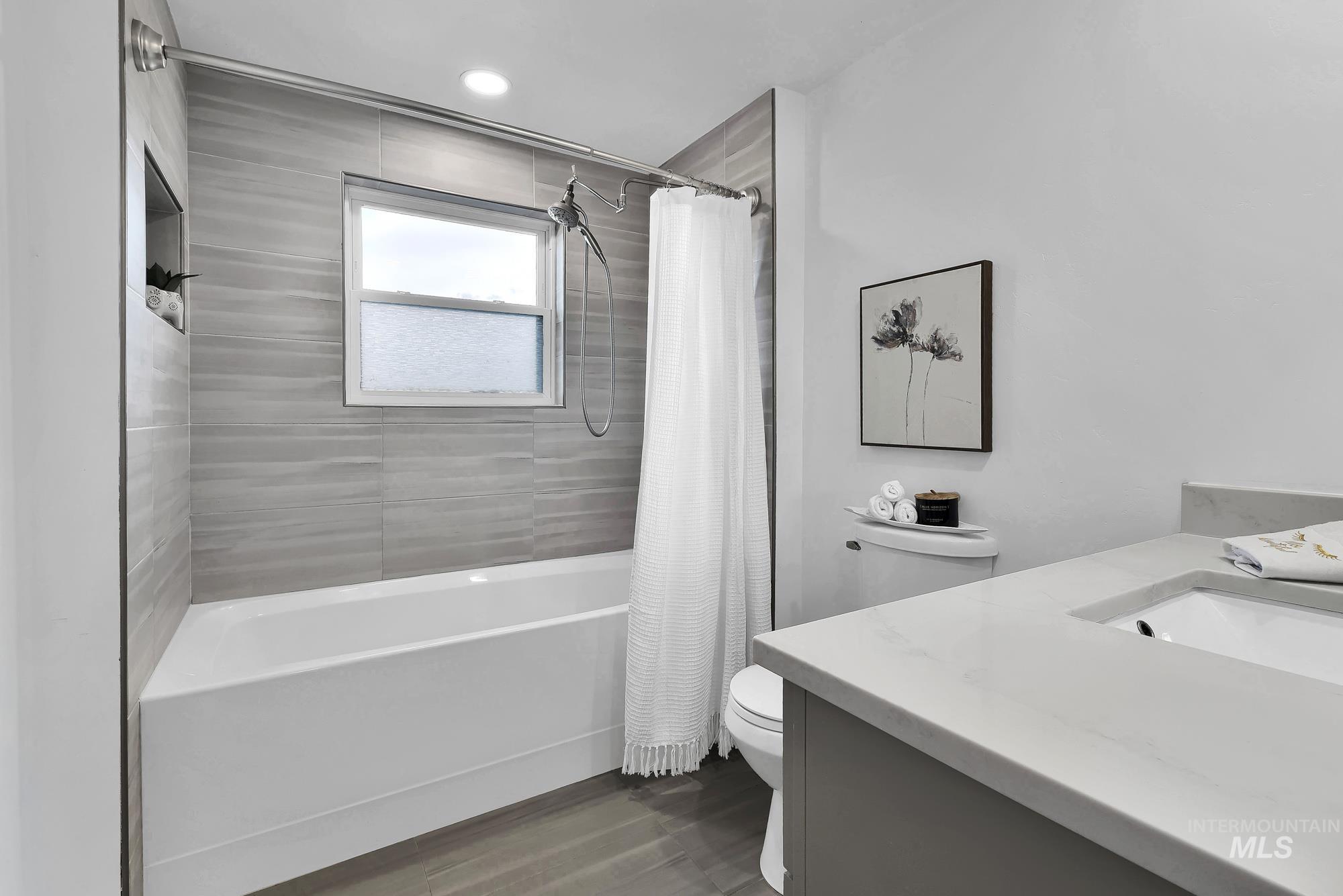3630 Beverly Street Boise, ID 83709 - Photo 23 of 50 Full bath with shower / bathtub combination with curtain, vanity, dark wood finished floors, and recessed lighting