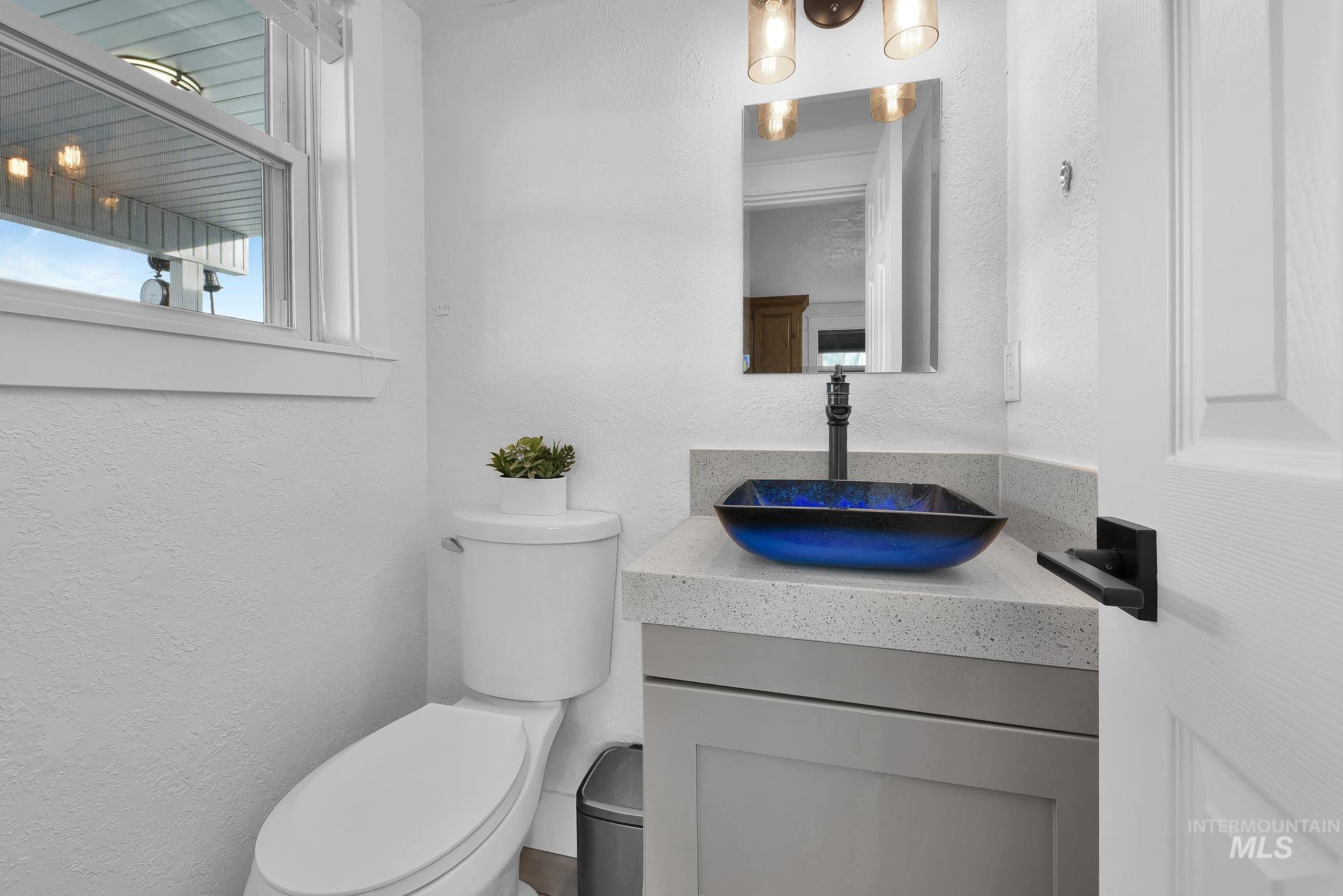 3630 Beverly Street Boise, ID 83709 - Photo 26 of 50 Half bathroom with a textured wall and vanity