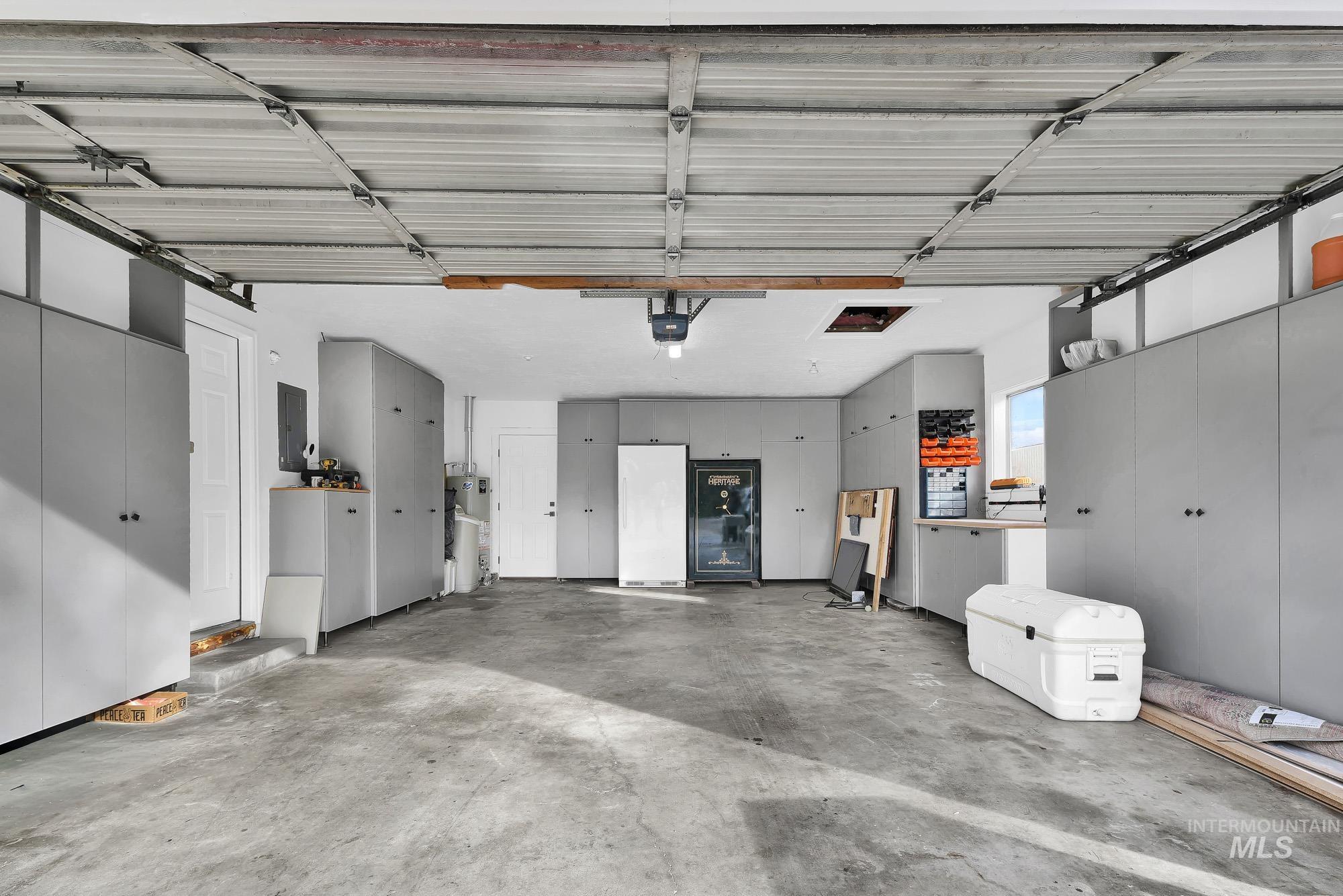 3630 Beverly Street Boise, ID 83709 - Photo 29 of 50 Garage featuring white fridge and electric panel