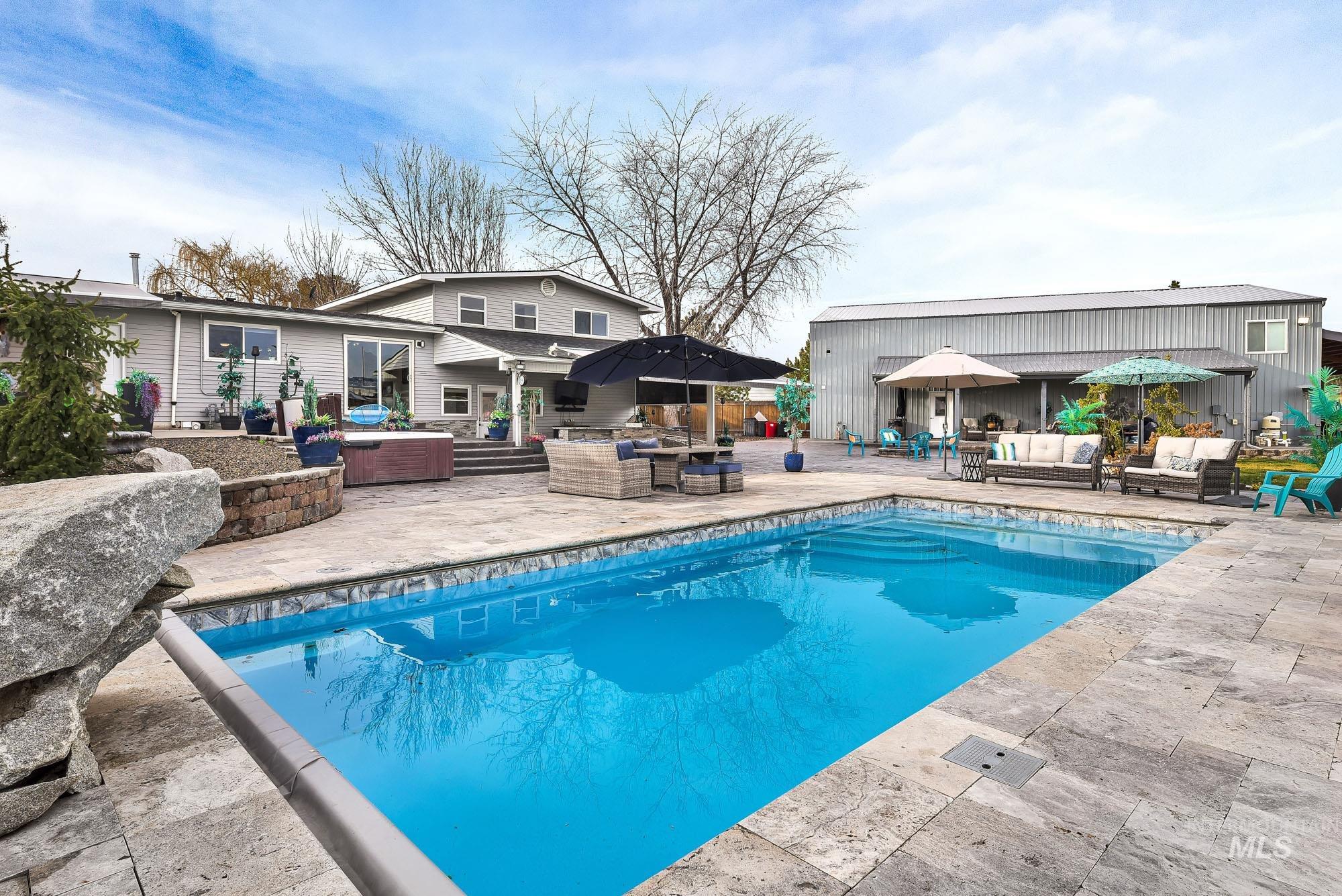 3630 Beverly Street Boise, ID 83709 - Photo 3 of 50 Swimming pool featuring outdoor lounge area, a patio, and exterior kitchen