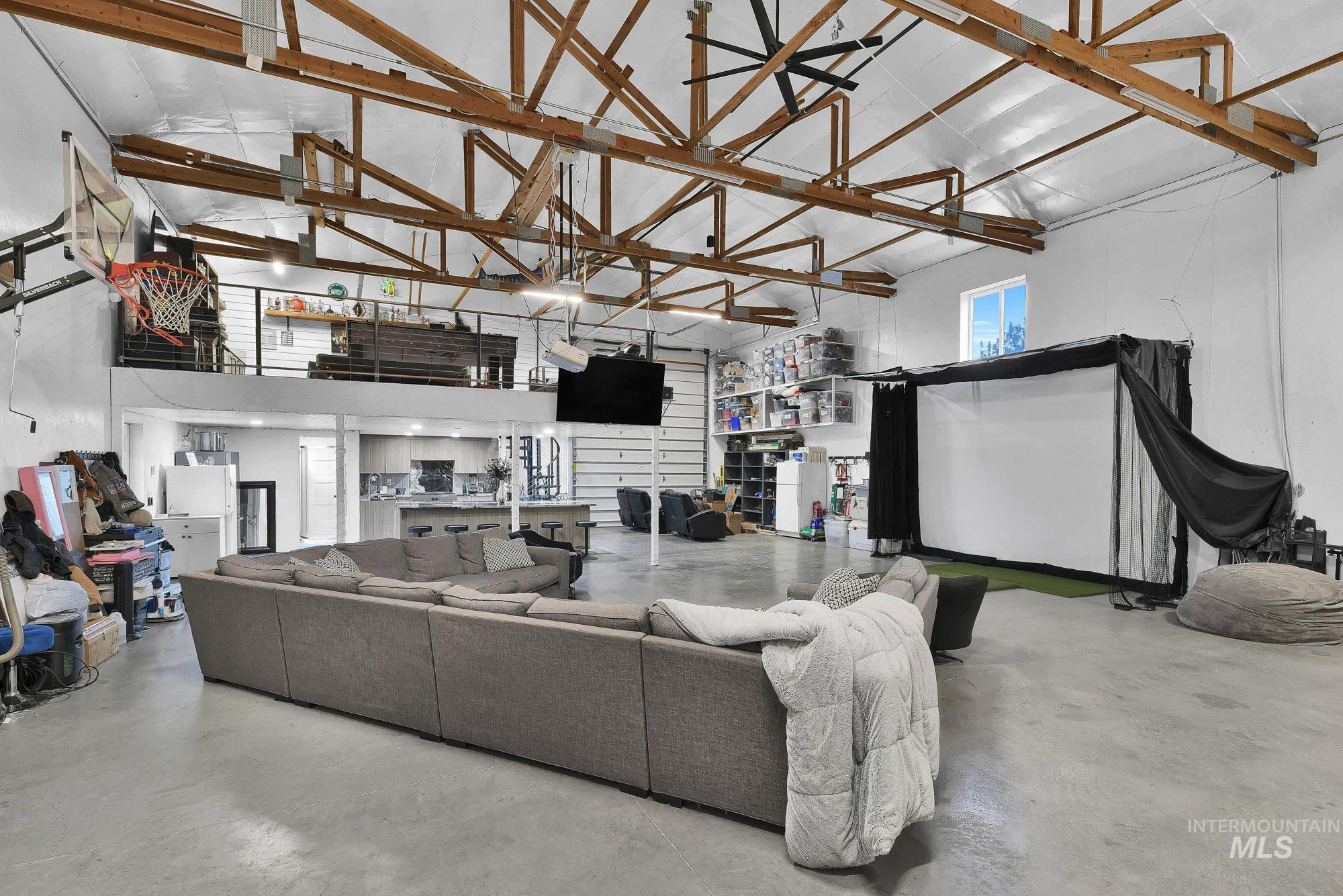 3630 Beverly Street Boise, ID 83709 - Photo 32 of 50 Living area with high vaulted ceiling and finished concrete floors