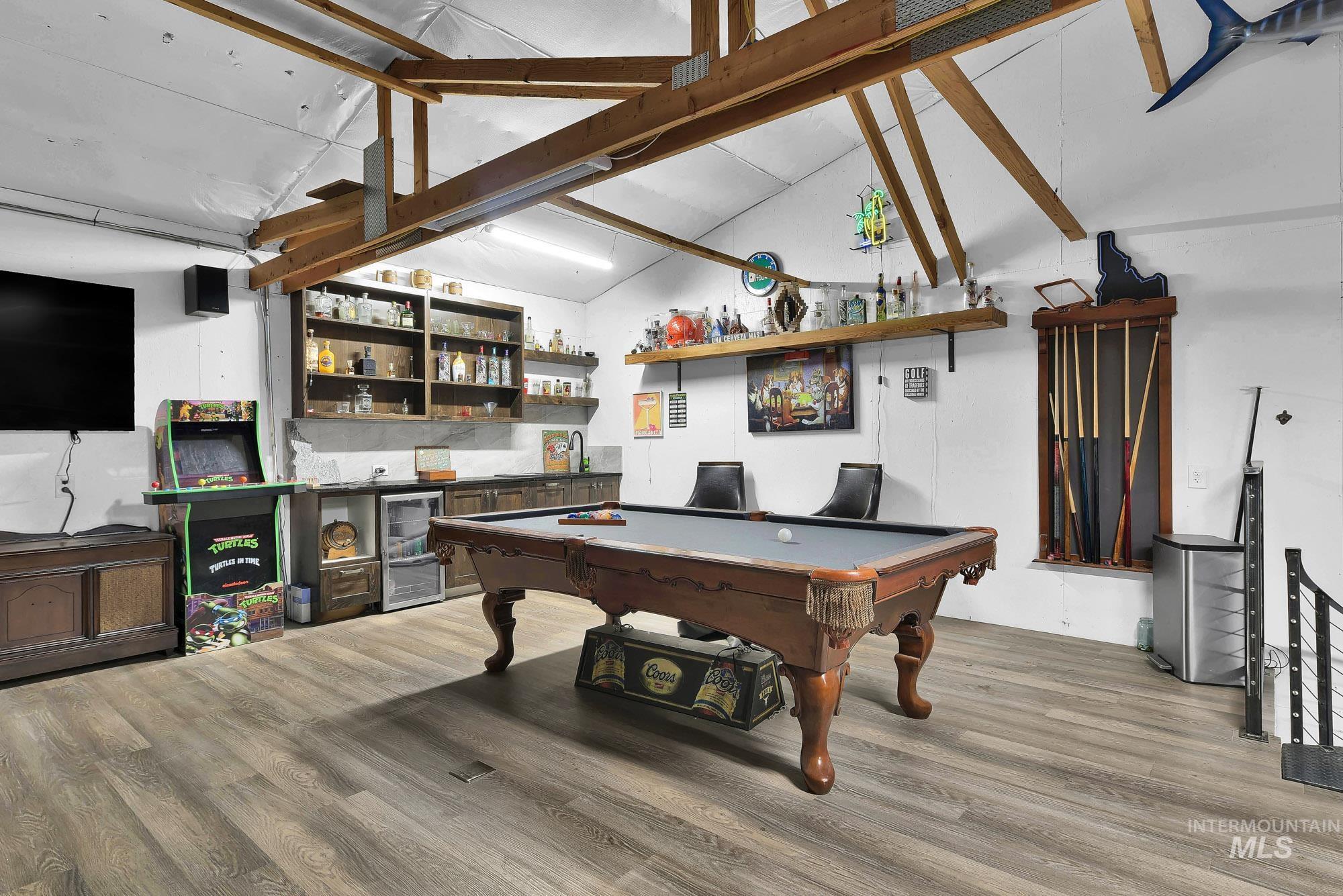 3630 Beverly Street Boise, ID 83709 - Photo 37 of 50 Recreation room with billiards table, light wood-style flooring, bar, beverage cooler, and high vaulted ceiling