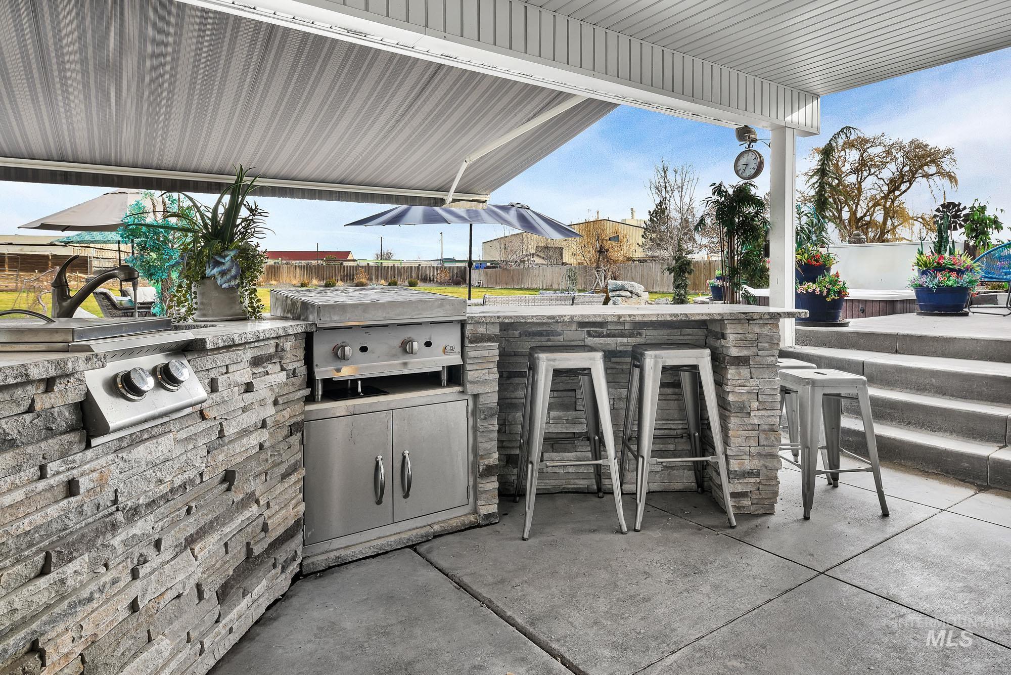 3630 Beverly Street Boise, ID 83709 - Photo 42 of 50 Fenced backyard with a patio and exterior kitchen
