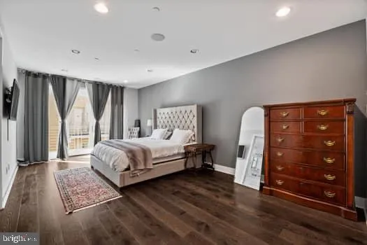 a bedroom with a bed and a dresser