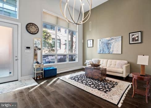 1332 Kater Street Philadelphia, PA 19147 - Photo 2 of 19 a living room with furniture a clock on wall and a window