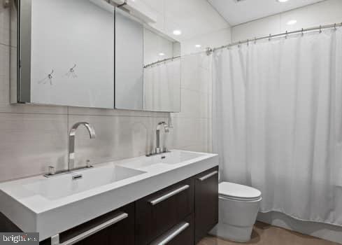 1332 Kater Street Philadelphia, PA 19147 - Photo 10 of 19 a bathroom with a sink and a mirror