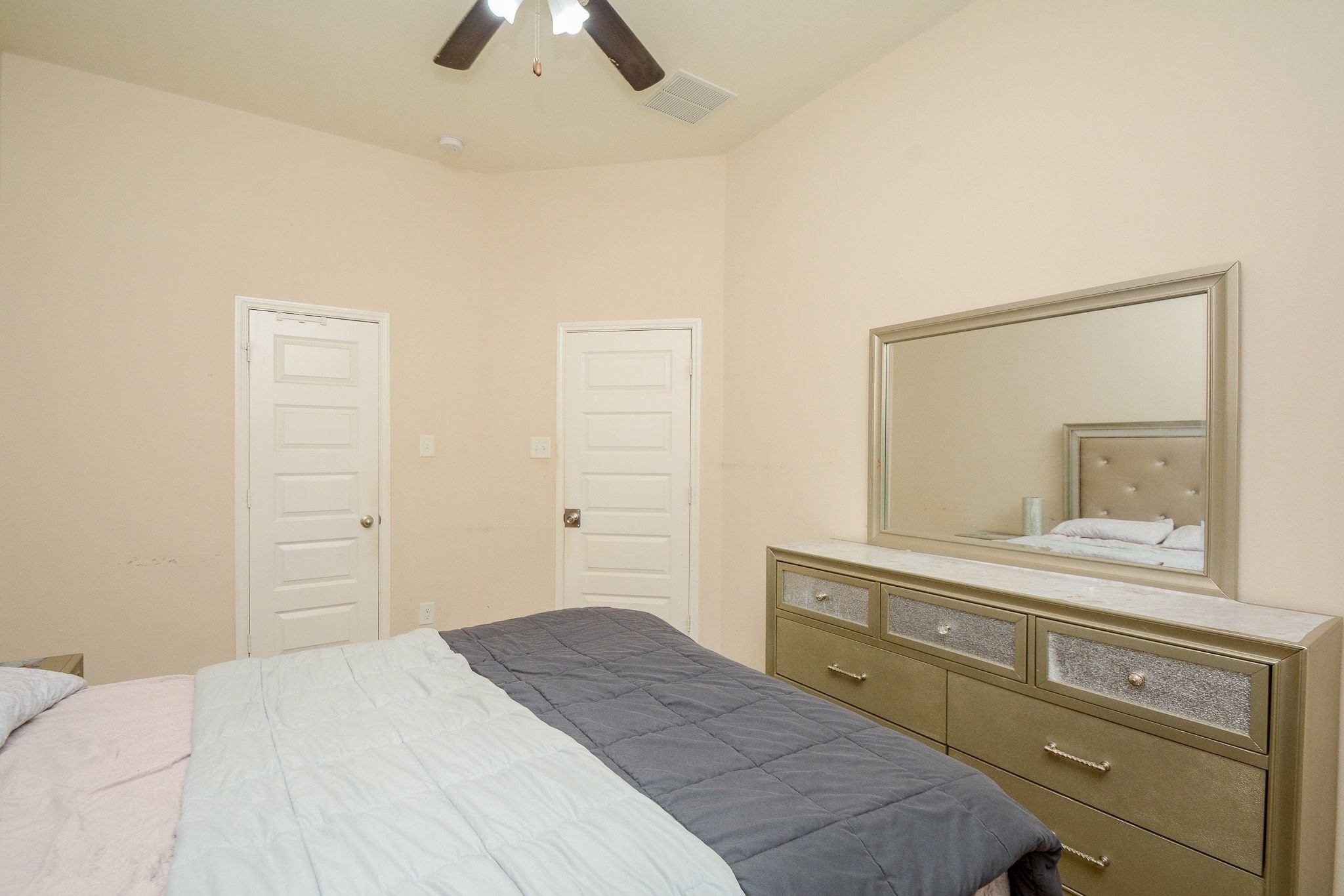 7046 Sliding Rock Circle Spring, TX 77379 - Photo 25 of 41 Explore the inviting charm of Bedroom upstairs, featuring ample space and a sleek, modern dresser.