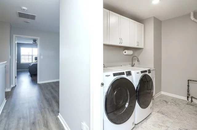 a view of a hallway with washer and dryer