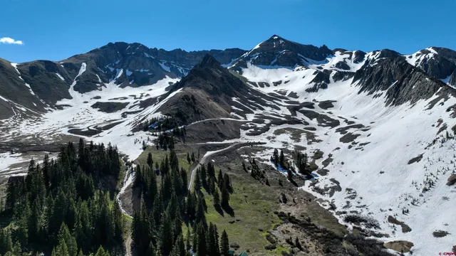 a view of a houses with mountains in the background