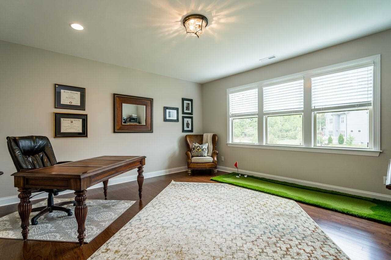 5268 Aleppo Lane Raleigh, NC 27613 - Photo 24 of 30 Spacious bonus room with hardwoods and updated light fixture used as another home office! Bonus