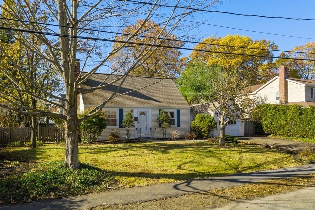 a house view with swimming pool in front of it