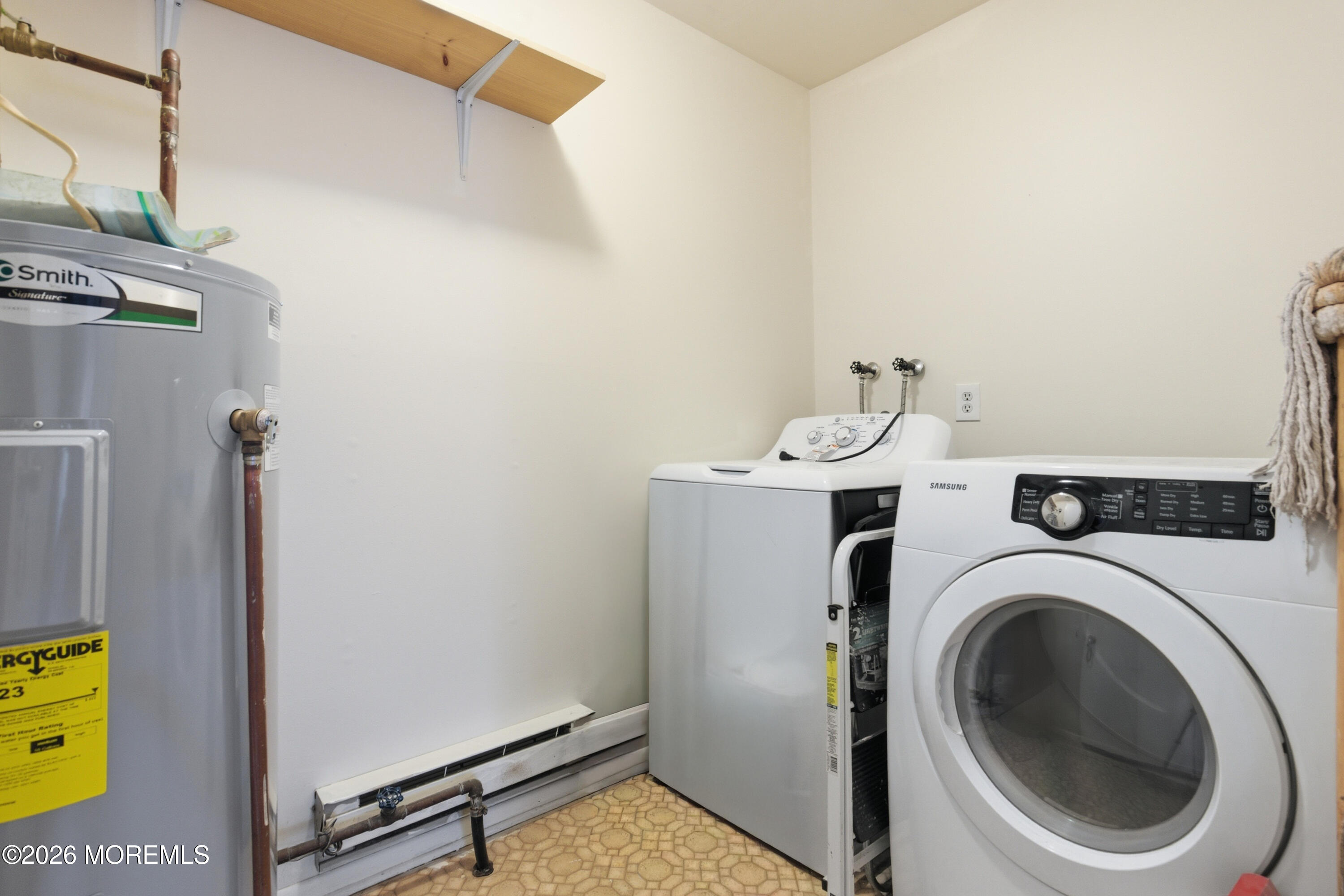 43 A Magnolia Road Manahawkin, NJ 08050 - Photo 18 of 18 a view of a storage & utility room with dryer and washer