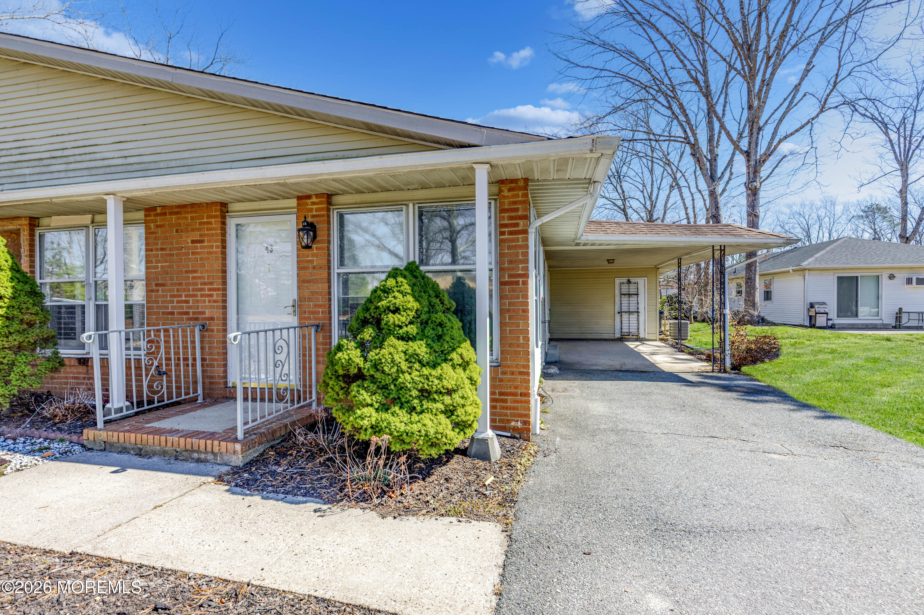 43 A Magnolia Road Manahawkin, NJ 08050 - Photo 2 of 18 a view of a house with a garden