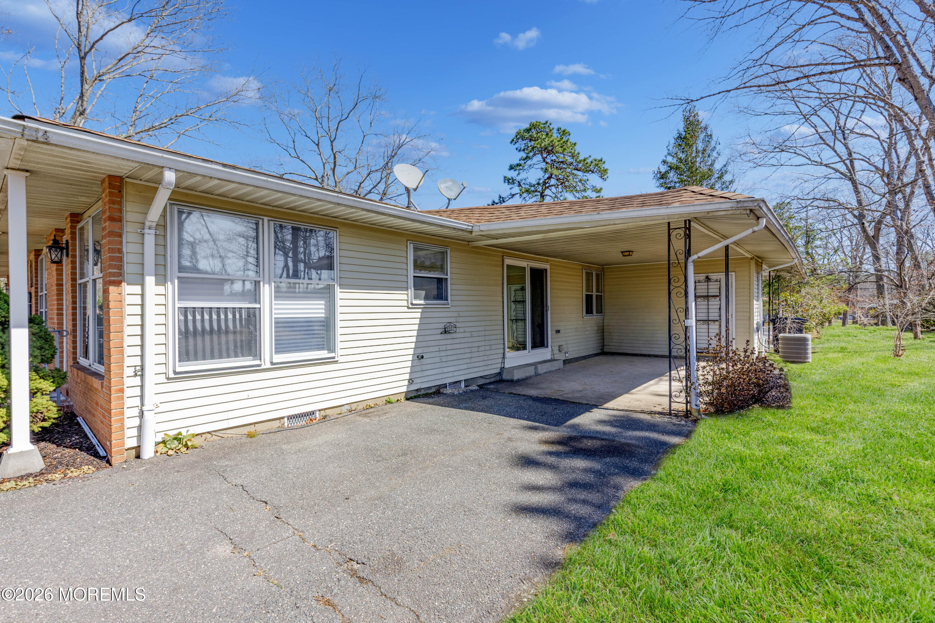43 A Magnolia Road Manahawkin, NJ 08050 - Photo 3 of 18 a view of a house with a yard and pathway
