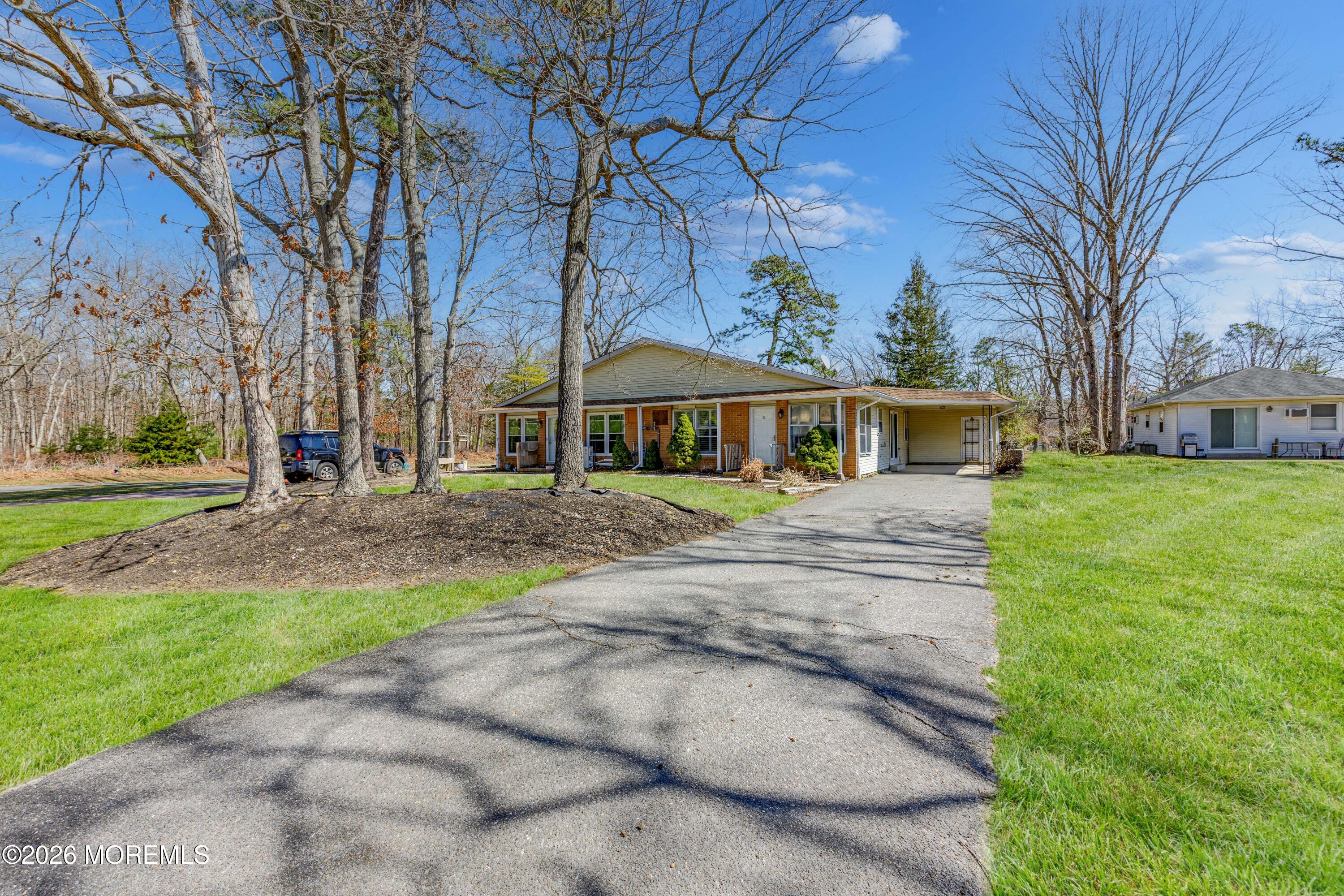 43 A Magnolia Road Manahawkin, NJ 08050 - Photo 4 of 18 a front view of house with a garden