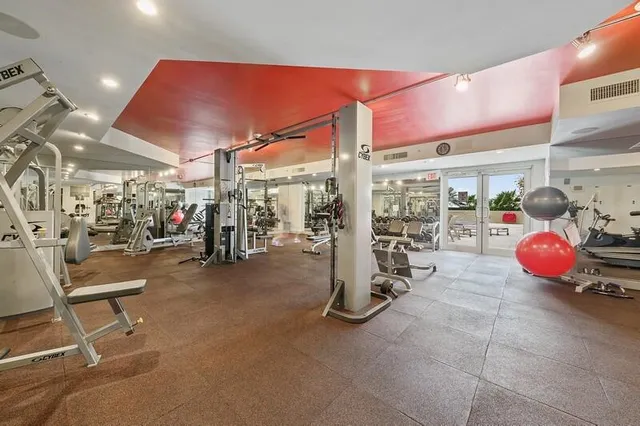 a room with furniture and air hockey table