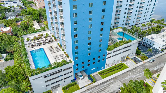 a picture of a building with a lot of flower plants